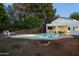 Backyard swimming pool and fire pit area perfect for entertaining at 5202 E Larkspur Dr, Scottsdale, AZ 85254