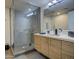 Sleek bathroom with glass enclosed shower with stylish tile and modern vanity at 535 W Thomas Rd # 513, Phoenix, AZ 85013