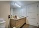 Bright bathroom boasts a modern vanity with storage and a well-lit mirror at 535 W Thomas Rd # 513, Phoenix, AZ 85013