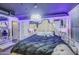 Luxurious bedroom boasts textured walls, mirrored accents, and a modern chandelier at 535 W Thomas Rd # 513, Phoenix, AZ 85013