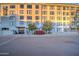 Apartment building exterior with manicured landscaping and ample parking at 535 W Thomas Rd # 513, Phoenix, AZ 85013
