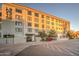 Well-maintained multi-story building with manicured landscaping and ample parking spaces at 535 W Thomas Rd # 513, Phoenix, AZ 85013