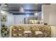 Stylish kitchen featuring a bar with seating, modern pendant lights, and stainless steel appliances at 535 W Thomas Rd # 513, Phoenix, AZ 85013