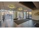 Modern lobby area with tiled floors, plants, and large glass windows with street view at 535 W Thomas Rd # 513, Phoenix, AZ 85013