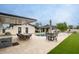 Spacious backyard featuring a pool, outdoor kitchen, and dining area, perfect for outdoor gatherings at 5441 E Wethersfield Rd, Scottsdale, AZ 85254