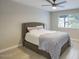 Cozy bedroom featuring a comfortable bed, neutral tones, and natural light from the window at 5441 E Wethersfield Rd, Scottsdale, AZ 85254