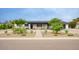 Charming single-story home featuring a well-manicured front yard with desert landscaping and brick pathway leading to the front door at 5441 E Wethersfield Rd, Scottsdale, AZ 85254
