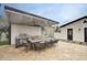 Spacious covered patio with outdoor kitchen and dining area for entertaining guests at 5441 E Wethersfield Rd, Scottsdale, AZ 85254