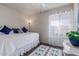 Bright bedroom featuring a daybed, wood floors, and an abundance of natural light at 5529 W Villa Maria Dr, Glendale, AZ 85308