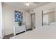 This bedroom features a neutral decor, a mirrored closet, and an attached bathroom at 5529 W Villa Maria Dr, Glendale, AZ 85308