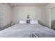 Neutral bedroom features a comfortable bed with soft lighting and minimalist decor at 5529 W Villa Maria Dr, Glendale, AZ 85308