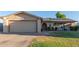 Charming single-story home with a two-car garage, solar panels, and well-maintained landscaping at 5529 W Villa Maria Dr, Glendale, AZ 85308