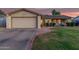 Charming single-Gathering home featuring a well-maintained lawn and a two-car garage at 5529 W Villa Maria Dr, Glendale, AZ 85308