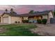 Charming single-Gathering home showcasing solar panels on the roof and a seating area in front at 5529 W Villa Maria Dr, Glendale, AZ 85308