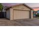 Beige one story home featuring a two-car garage and seating area at 5529 W Villa Maria Dr, Glendale, AZ 85308