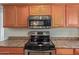 Modern kitchen features stainless steel appliances, wood cabinets and countertop at 5529 W Villa Maria Dr, Glendale, AZ 85308