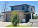 Modern two-story home featuring a brick facade, gray siding, and a well-manicured front yard at 5537 E Earll Dr, Phoenix, AZ 85018