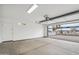 Clean and spacious garage offering ample parking and storage, with an automatic door at 5537 E Earll Dr, Phoenix, AZ 85018