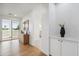 Hallway with a sliding glass door, a decorative cabinet, and wood floors at 5537 E Earll Dr, Phoenix, AZ 85018