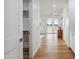 Hallway with hardwood flooring and an open closet to the left at 5537 E Earll Dr, Phoenix, AZ 85018
