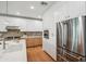 Modern kitchen with white cabinets, stainless steel appliances, and an island at 5537 E Earll Dr, Phoenix, AZ 85018