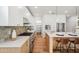 Bright kitchen featuring white and wood cabinetry, stainless appliances, and an island at 5537 E Earll Dr, Phoenix, AZ 85018