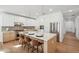Stylish kitchen showcasing a large island with bar seating, white cabinets, and stainless steel appliances at 5537 E Earll Dr, Phoenix, AZ 85018