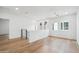 Bright loft featuring hardwood floors, white walls, and light-filled windows at 5537 E Earll Dr, Phoenix, AZ 85018