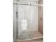Modern shower with glass door, rainfall shower head, and tiled walls, creating a spa-like experience at 5537 E Earll Dr, Phoenix, AZ 85018