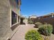 Spacious backyard with desert landscaping and a covered patio at 5635 W Huntington Dr, Laveen, AZ 85339