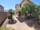 Backyard featuring a covered patio and lush landscaping at 5635 W Huntington Dr, Laveen, AZ 85339