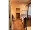 The bathroom features a walk-in closet, a shower with glass door and tile flooring at 5635 W Huntington Dr, Laveen, AZ 85339