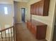 Upstairs hallway with built-in cabinets and access to a bathroom at 5635 W Huntington Dr, Laveen, AZ 85339