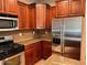 Close-up shot showcasing granite countertops, stainless steel appliances, and wooden cabinetry in kitchen at 5635 W Huntington Dr, Laveen, AZ 85339