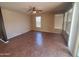 The sunlit living room features tile floors and ample windows with outside views at 5635 W Huntington Dr, Laveen, AZ 85339