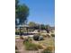 Community playground with picnic tables and landscaping at 5635 W Huntington Dr, Laveen, AZ 85339