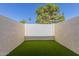 Private backyard features artificial turf and enclosed wall for added privacy at 6004 N 79Th St, Scottsdale, AZ 85250