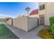 Townhome featuring desert landscaping, a palm tree, and a private courtyard entry at 6004 N 79Th St, Scottsdale, AZ 85250