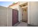 Close-up of the front door with decorative gate and inviting 'hello' mat at 6004 N 79Th St, Scottsdale, AZ 85250