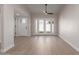 Bright living room featuring wood floors and glass doors leading to the outdoors at 6004 N 79Th St, Scottsdale, AZ 85250