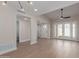 Living room with wood floors, modern fan, and glass doors leading to the outdoors at 6004 N 79Th St, Scottsdale, AZ 85250