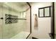 Modern bathroom featuring a walk-in shower with stylish tile accents and a convenient shower niche at 6102 E Friess Dr, Scottsdale, AZ 85254