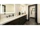 Bathroom featuring a double vanity, granite countertop, and modern fixtures at 6102 E Friess Dr, Scottsdale, AZ 85254