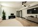 Bedroom with natural light, ceiling fan, and light wood floors at 6102 E Friess Dr, Scottsdale, AZ 85254