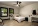 Bedroom with plush bed, desk, and a makeup vanity at 6102 E Friess Dr, Scottsdale, AZ 85254
