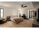 Spacious bedroom with modern décor, light wood floors and a ceiling fan at 6102 E Friess Dr, Scottsdale, AZ 85254
