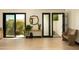 Bright entryway featuring light wood floors, stylish decor, and view to a landscaped courtyard at 6102 E Friess Dr, Scottsdale, AZ 85254