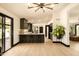 Open-concept kitchen features dark cabinetry, sleek countertops, and bar seating at 6102 E Friess Dr, Scottsdale, AZ 85254