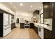 Bright, open kitchen with white countertops, stainless steel appliances, and dark wood cabinets at 6102 E Friess Dr, Scottsdale, AZ 85254