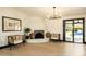 Bright living room showcasing neutral tones, elegant chairs, and a sleek fireplace feature at 6102 E Friess Dr, Scottsdale, AZ 85254